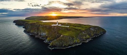 Panorama of Sunset over Mull of Galloway Lighthouse from a drone, Mainland Scotland, Scotland, UK