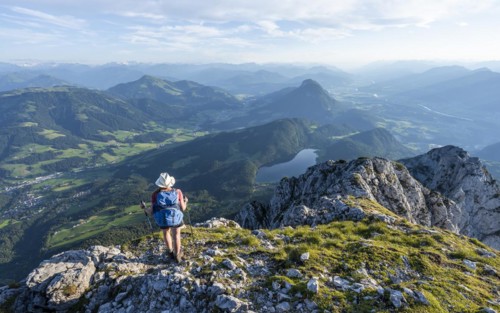 Hintersteiner Lake in the mountains, view from Schaffauer, hiker on a ridge in the mountains,