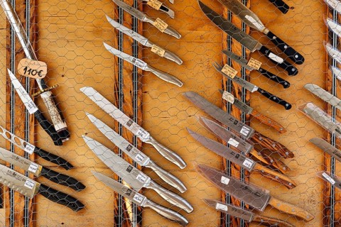 Traditional Portuguese knives in front of a souvenir shop, different shapes and materials, Ã“bidos,