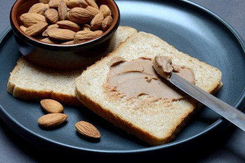 Toast with almond cream and almond shell, spread