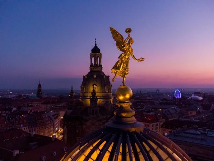 Dresden's old town from above.The glass dome of the Academy of Arts, crowned by a Fama figure,