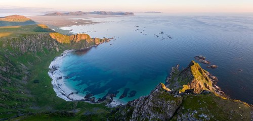 View from Mount Matinden of sandy beach and rocky coast, Bleik, Andoya Island, Vesteralen, Norway,