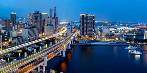 Kobe skyline from above with harbour and elevated road panorama at night in Kobe, Japan, Asia