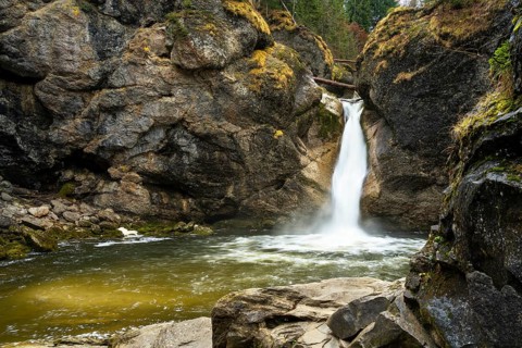 The lower part of the Buchenegg waterfalls, surrounded by rocks. Autumn. Oberstaufen, Upper
