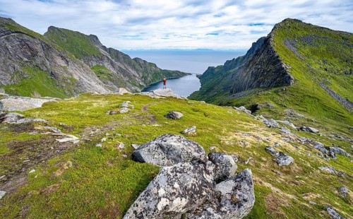 Mountaineers on the hiking trail to Munkebu hut, view of the fjord Djupfjorden and mountain