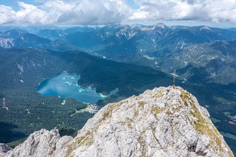 Aerial view, summit cross of the Waxenstein, Eibsee lake and Wetterstein mountains,
