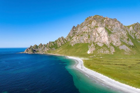 White sandy beach and mountains near Bleik, Andoya Island, Vesteralen, Norway, Europe