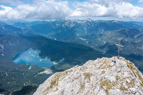 Aerial view, summit cross of the Waxenstein, Eibsee lake and Wetterstein mountains,