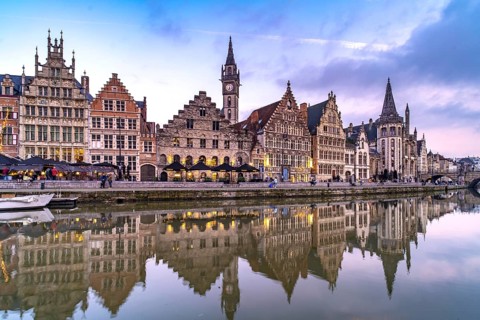 Medieval guild houses of Graslei Kai on the river Leie at dusk, Ghent, Belgium, Europe
