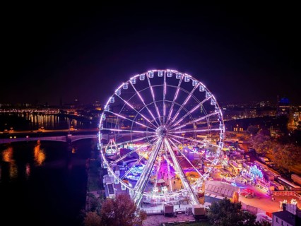 A 55m high illuminated Ferris wheel is the landmark of the fair at the Volksfest grounds on
