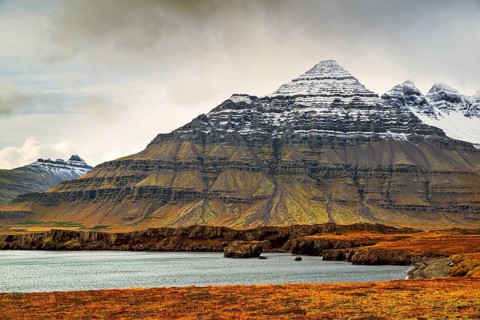 Mountain view in Stodvarfjordur on the east side of Iceland in a cloudy day