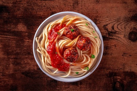 Meatballs. Beef meat balls, overhead shot with spaghetti pasta, parsley, and tomato sauce, on a