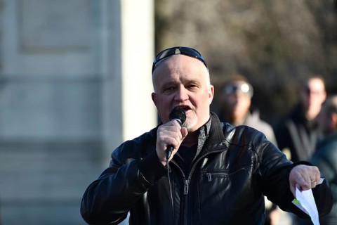 CHRISTCHURCH, NEW ZEALAND, JULY 24, 2021, A man speaks at a protest rally at the Bridge of