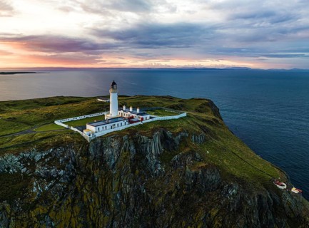 Sunset over Mull of Galloway Lighthouse from a drone, Mainland Scotland, Scotland, UK