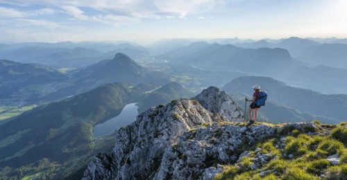 Hintersteiner Lake in the mountains, view from Schaffauer, hiker on a ridge in the mountains,