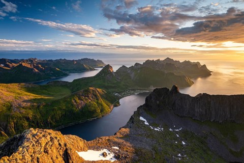 View over Senja's fjords and mountain peaks under the midnight sun, Mount Grytetippen, Senja,
