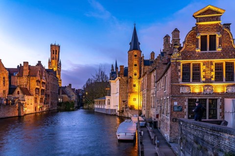 Rozenhoedkaai canal with belfry at dusk, Bruges, Belgium, Europe