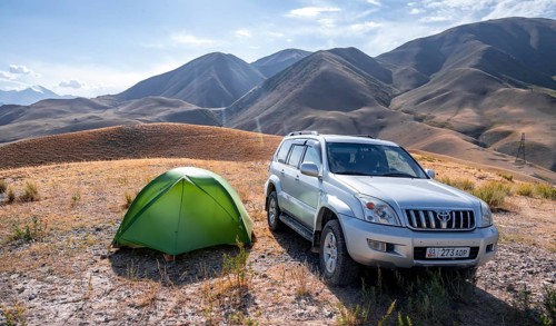 Toyota Landcruiser and tent on a hill, Chuy province, Kyrgyzstan, Asia