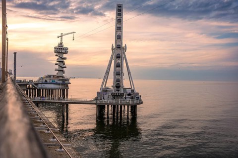 Ferris wheel at sunset on the pier at the beach, The Hague, Netherlands