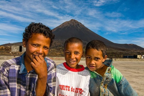 Smiling, happy boys in front of vulcano on Fogo. Cabo Verde. Africa