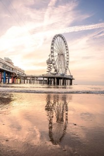 Ferris wheel on the pier on the beach at sunset, The Hague, Netherlands