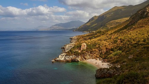 Cloudy weather, coastline, green coastal mountains, small bay, pebble beach, bathers, Zingaro,