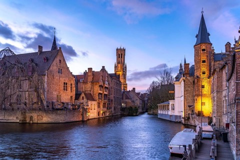 Rozenhoedkaai canal with belfry at dusk, Bruges, Belgium, Europe