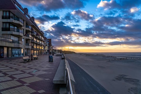 Sunset on the beach promenade of De Haan, Belgium, Europe