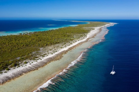 Catamaran off Apataki Atoll, Tuamotu Archipelago, French Polynesia, Oceania