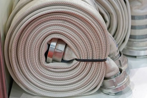 High pressure fire hose in coil