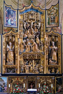 Central carved winged altar with predella, above Crucifixion of Jesus, below Carrying of the Cross,
