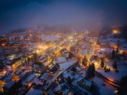 Snow-covered Seiffen with the mountain church