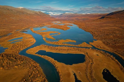 Drone shot, view of the valley Vistasvagge with the meandering river Vistasjakka and countless