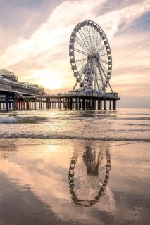 Ferris wheel at sunset on the pier at the beach, The Hague, Netherlands