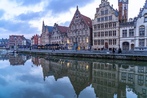 Medieval guild houses of Graslei Kai on the river Leie at dusk, Ghent, Belgium, Europe