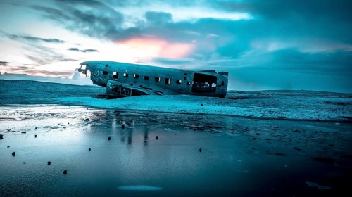 Aerial drone view of crashed plane on frozen Solheimasandur beach in winter, Iceland, Europe