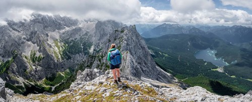 Mountaineer climbing Waxenstein, Eibsee lake and Wetterstein Mountains, Garmisch-Patenkirchen,