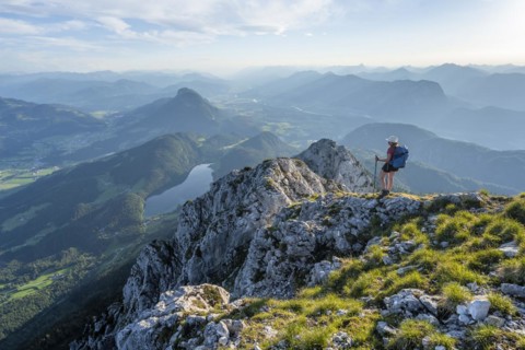 Hintersteiner Lake in the mountains, view from Schaffauer, hiker on a ridge in the mountains,