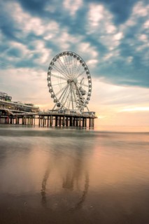Ferris wheel at sunset on the pier at the beach, The Hague, Netherlands