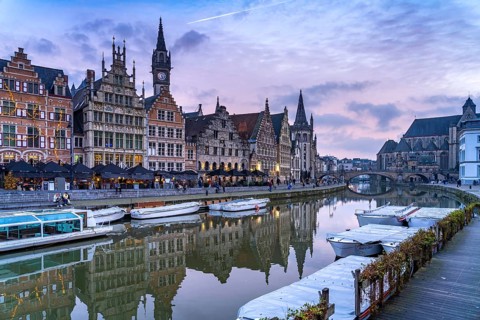 Medieval guild houses of Graslei Kai on the river Leie at dusk, Ghent, Belgium, Europe