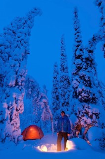 Man with bivouac in the snow, Lapland, Sweden, Europe