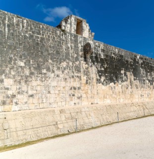 Walls of the ball court with stone hoop, Juego de Pelota, Chichen Itza, Mayan ruins, Yucatan,