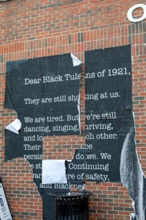 Tulsa, Oklahoma, A defaced poster in the Greenwood District, known as the Black Wall Street. The