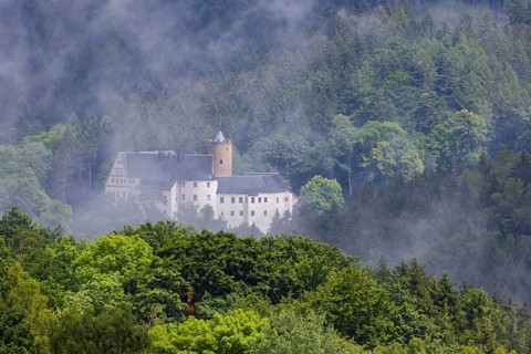 Scharfenstein Castle seen through the rain and fog