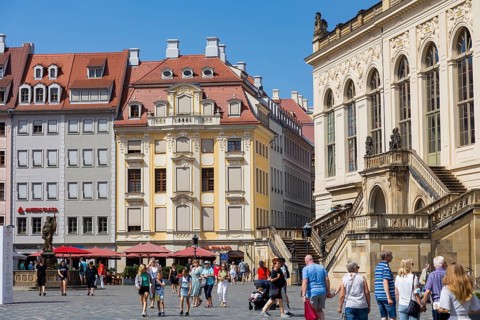 Tourists stroll across the Neumarkt in Dresden
