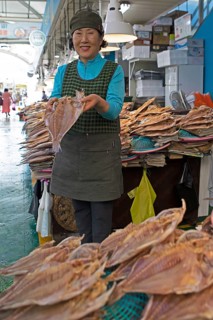 Korean market woman, 65, with dried grouper, Yeosu Fish Market, Yeosu, Jeollanam-do Province, South