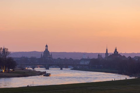 Evening sky over the old town of Dresden with the Church of Our Lady, the castle tower, the