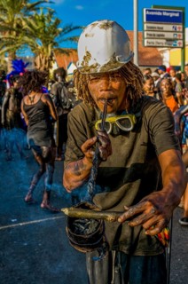 Man with helmet, costumed as constructer. Carnival. Mindelo. Cabo Verde. Africa