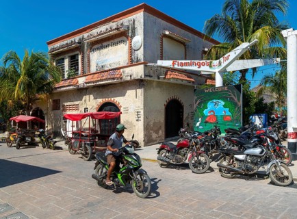 Street scene with motorcycle vehicles in centre of small settlement of Celestun, Yucatan, Mexico,