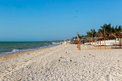 Sandy beach and sea of Gulf of Mexico, coastal fishing settlement of Celestun, Yucatan, Mexico,